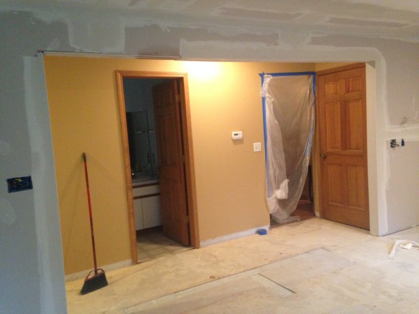 New Wall Opening for a Larger Kitchen Space. Notice Imprinting on the Floor Marking the Removed Wall